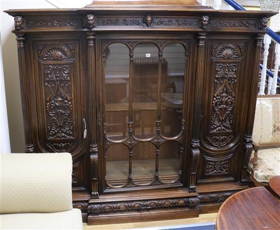 A large 19th century French carved walnut breakfront bookcase by Bellanger, Meubles dArt, W.200cm